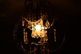 An ornate chandelier casting soft light in an elegant foyer.