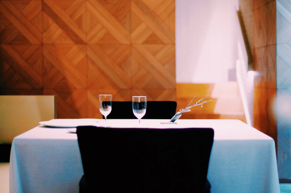 two wine glasses on table