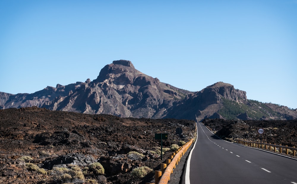 gray roadway near mountain