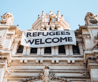 building with refugees welcome signage