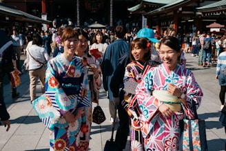 A vibrant display of young women wearing colorful Korean casual dresses in a lively urban setting.