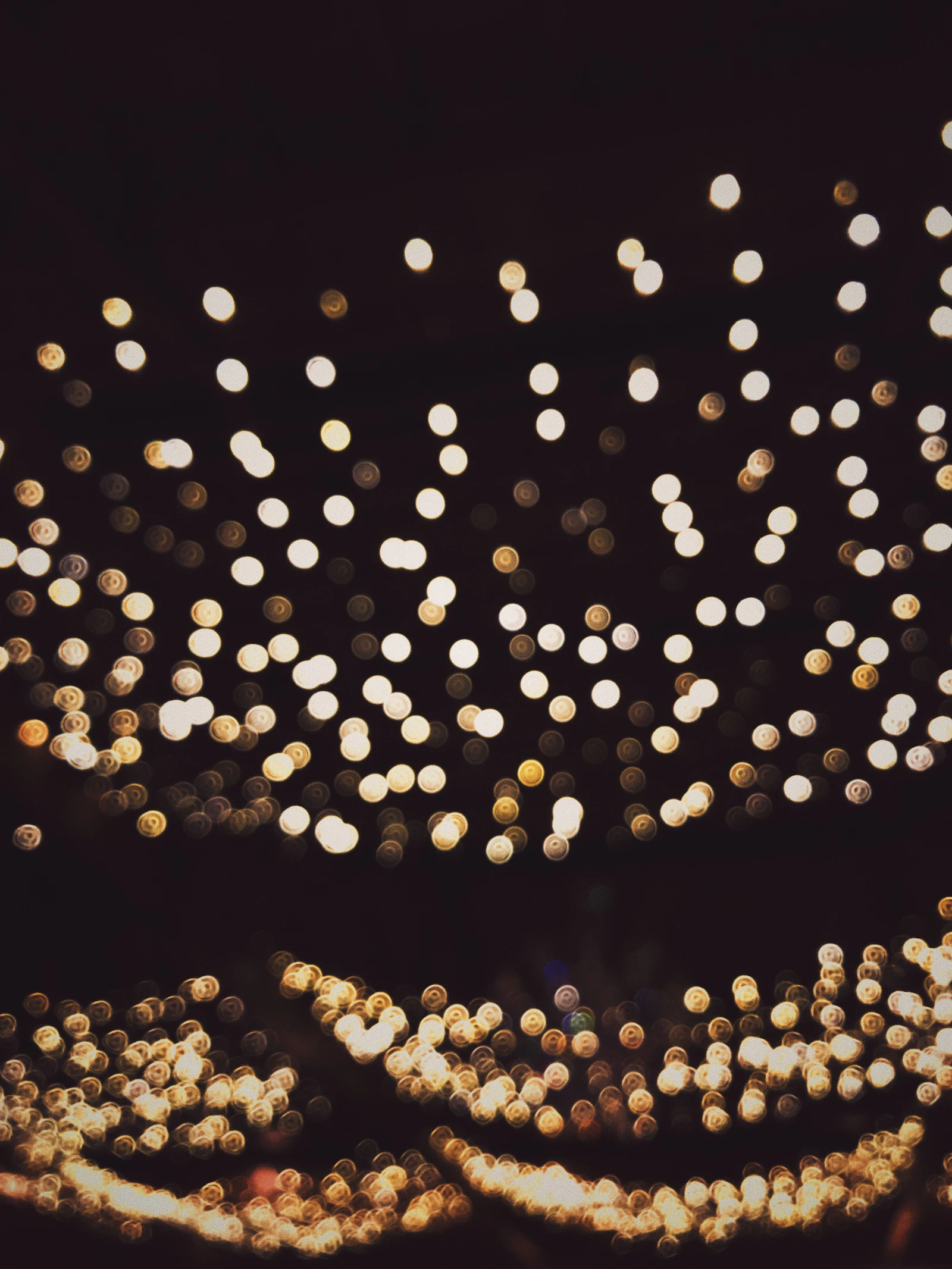 Warm fairy lights glowing in the dark