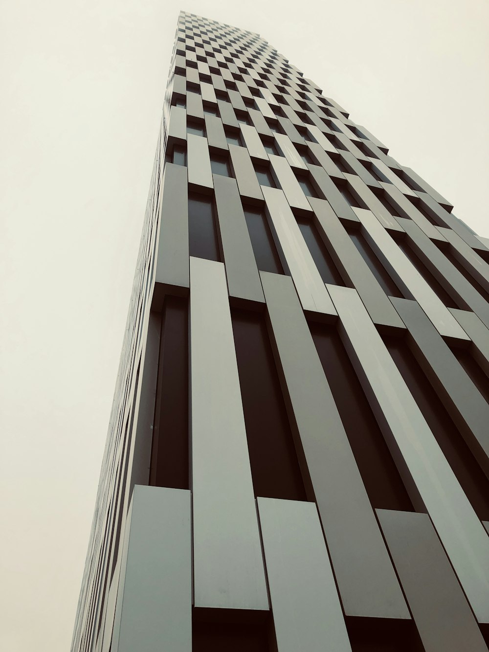 low-angle photography high-rise building during daytime