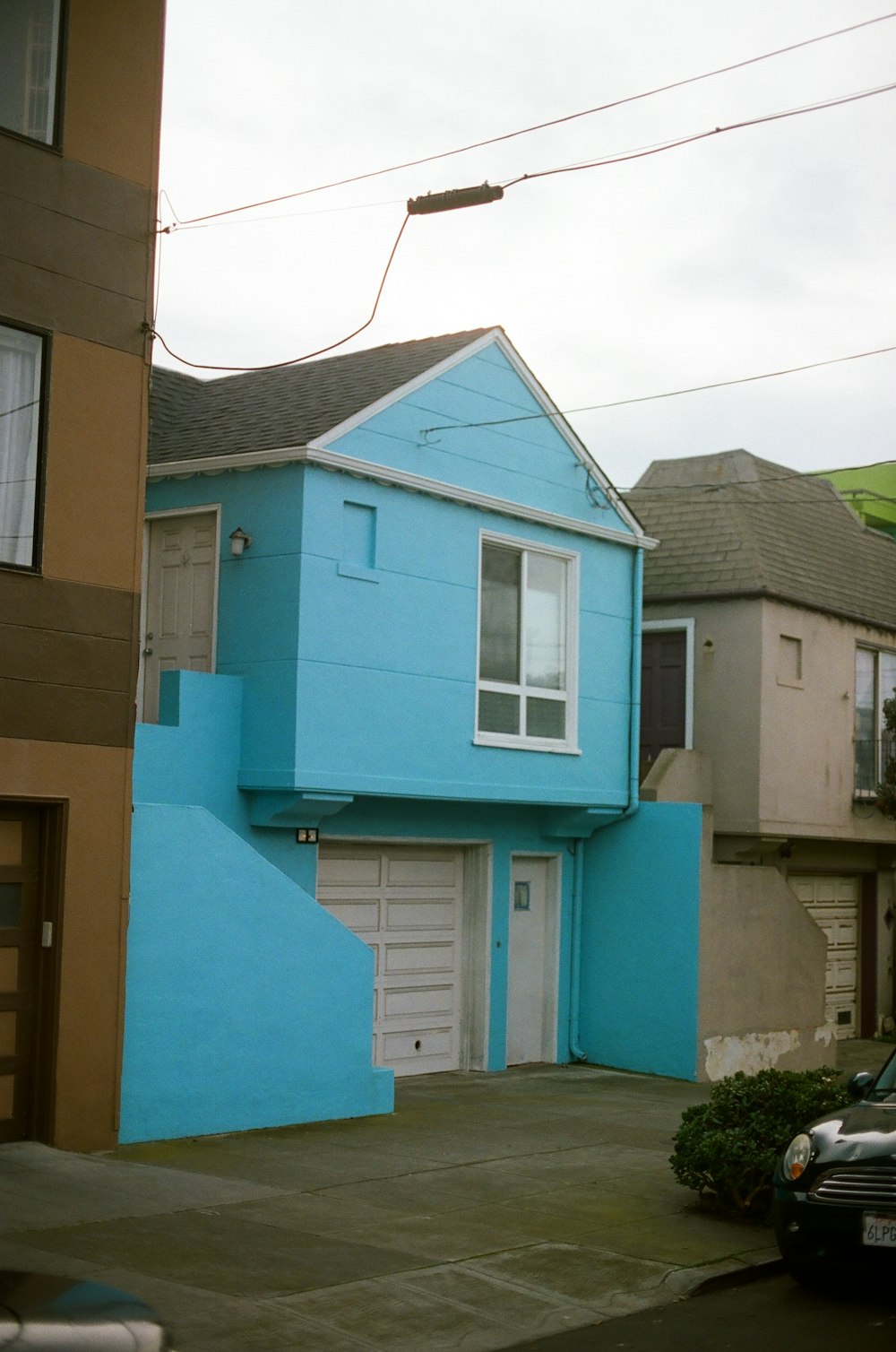 blue 2-storey house under gray sky