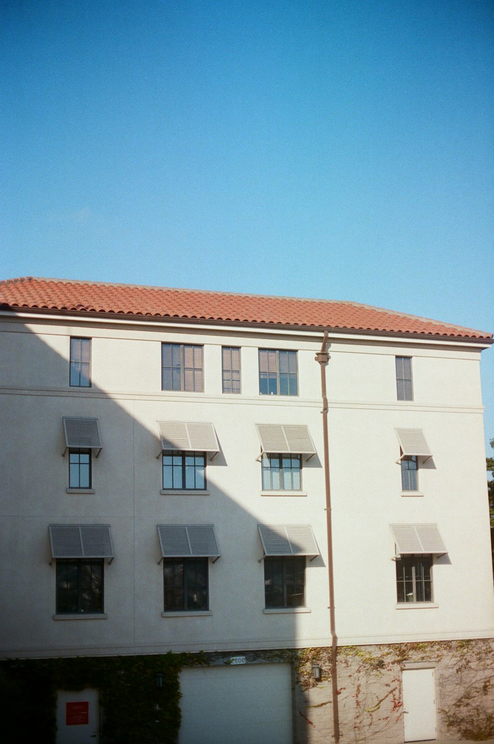 white and brown 4-storey building