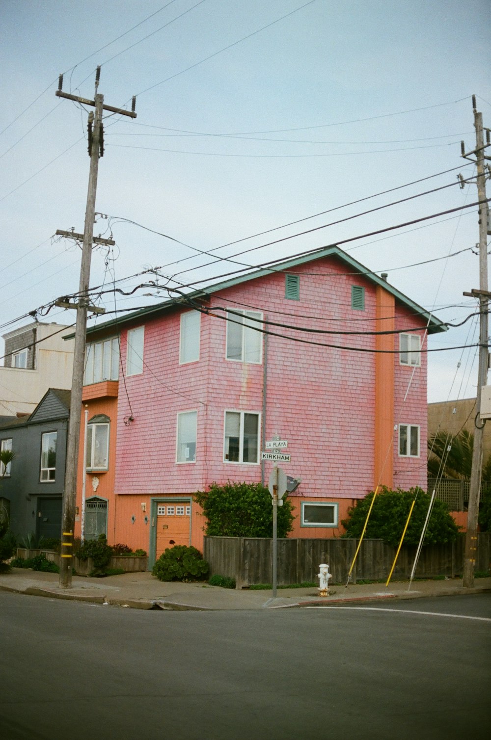 pink concrete building near post