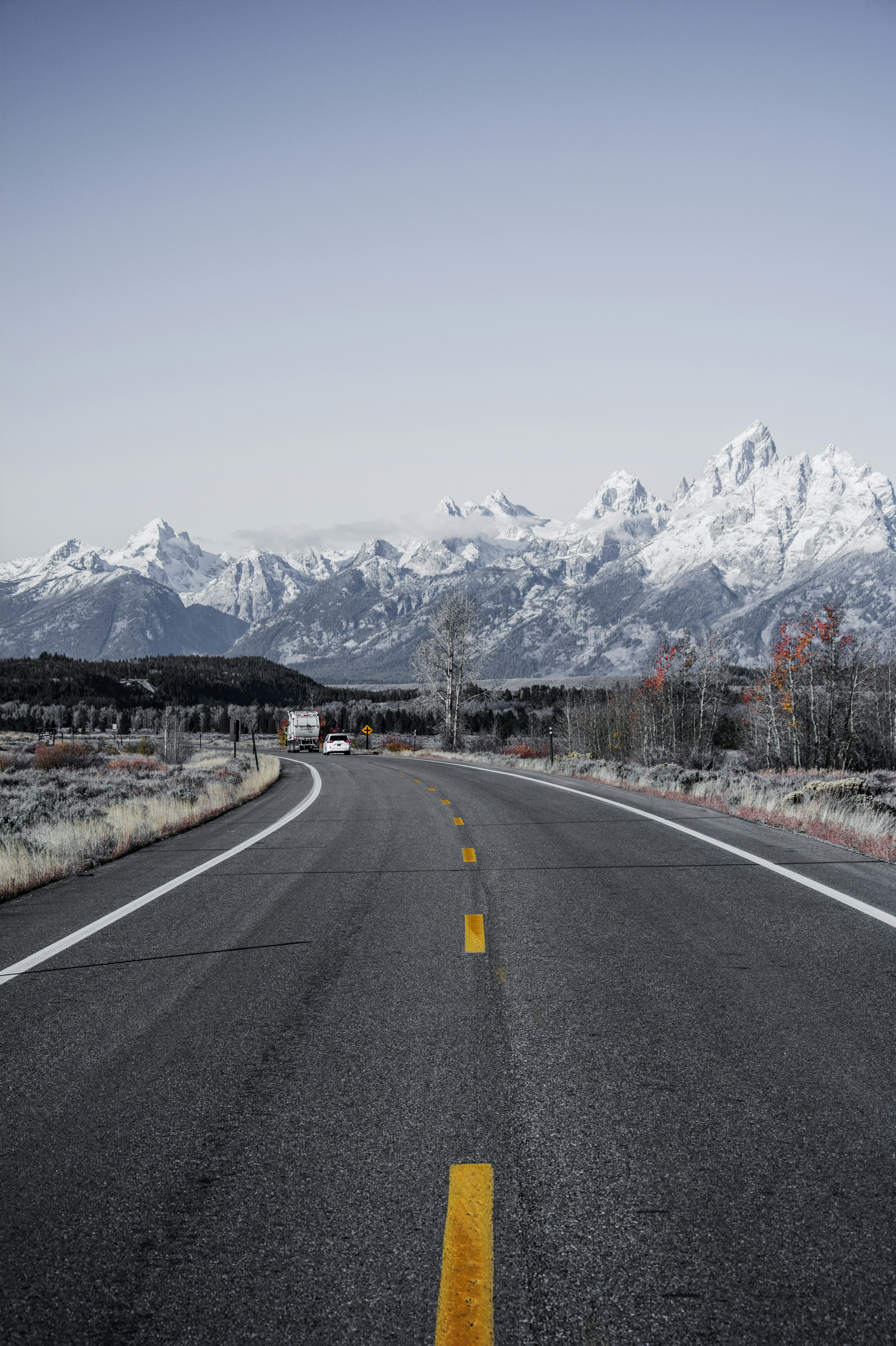 black asphalt road under blue sky during daytime