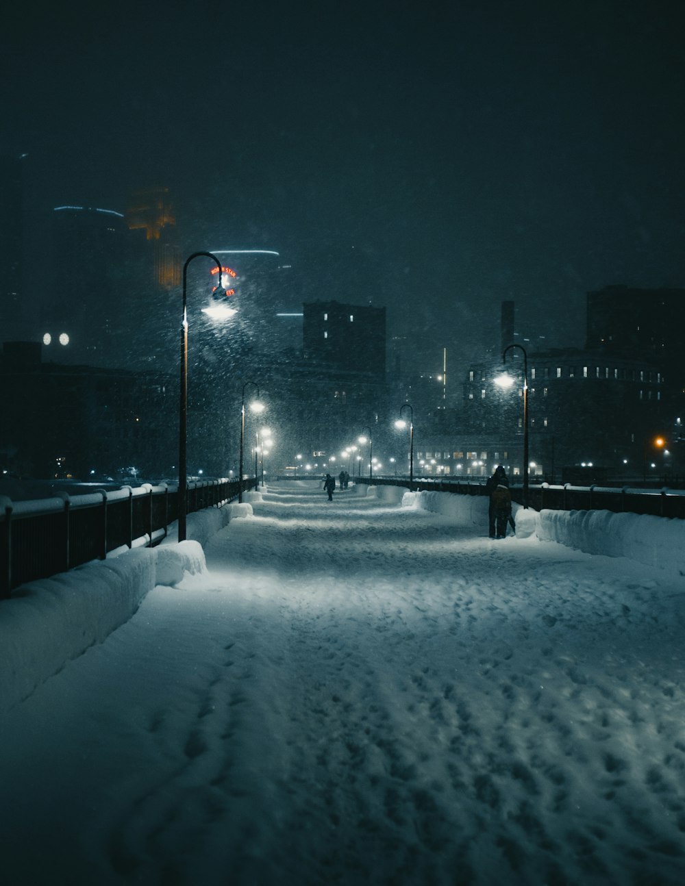 snow covered road at night