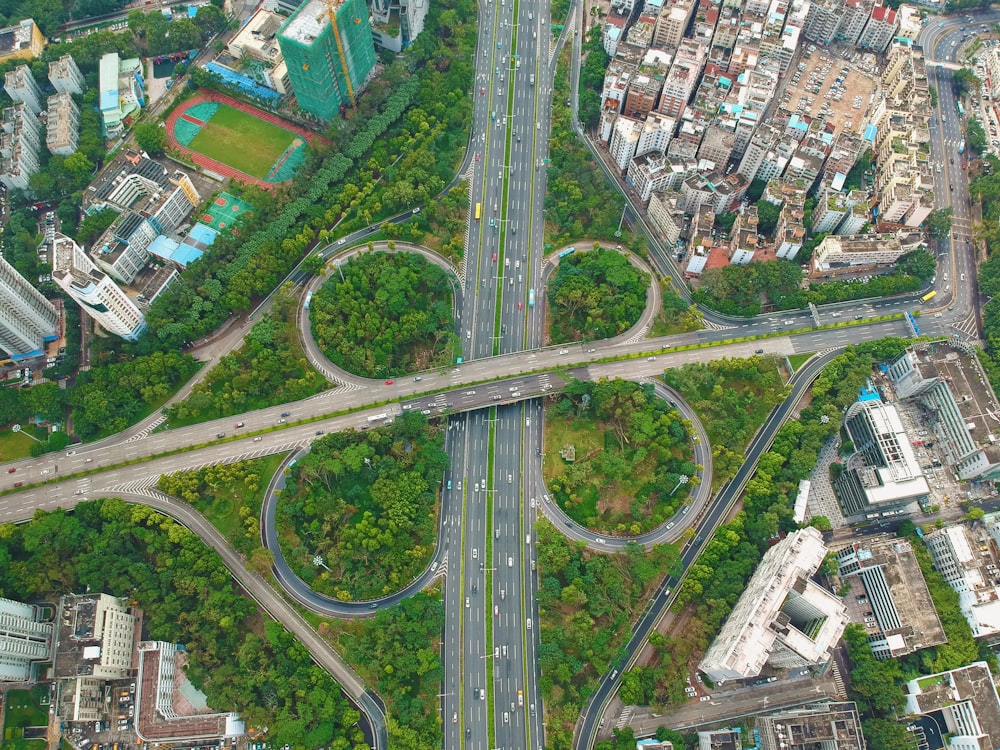 aerial view of vehicles, bridge and buildings