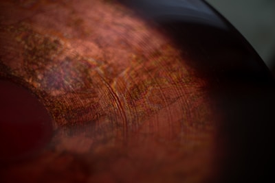 A close-up of intricate vinyl designs on a surface.