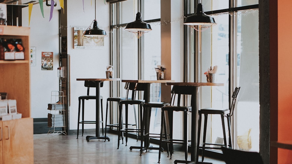 black and brown wooden table and chairs