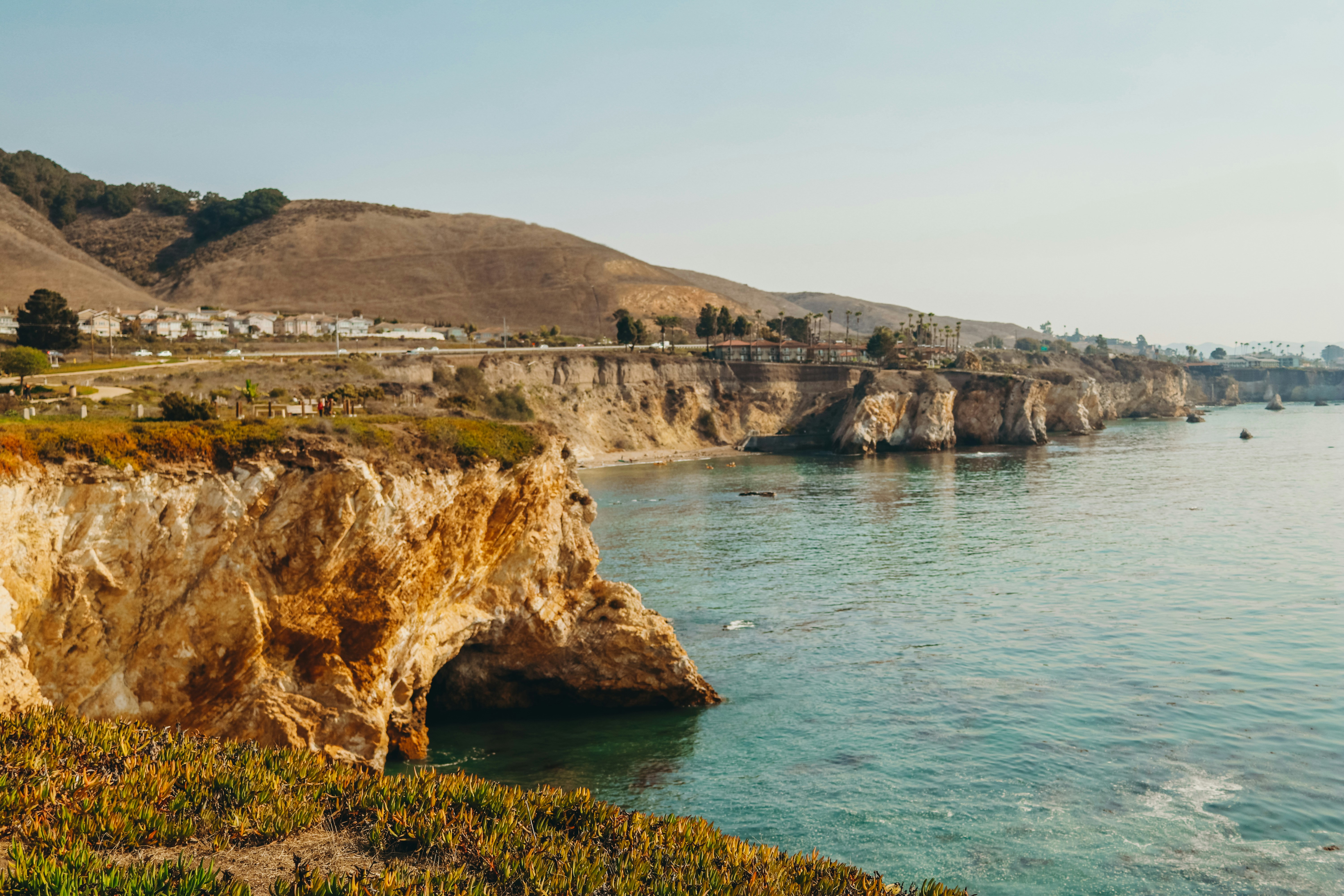 cliff near ocean during daytime