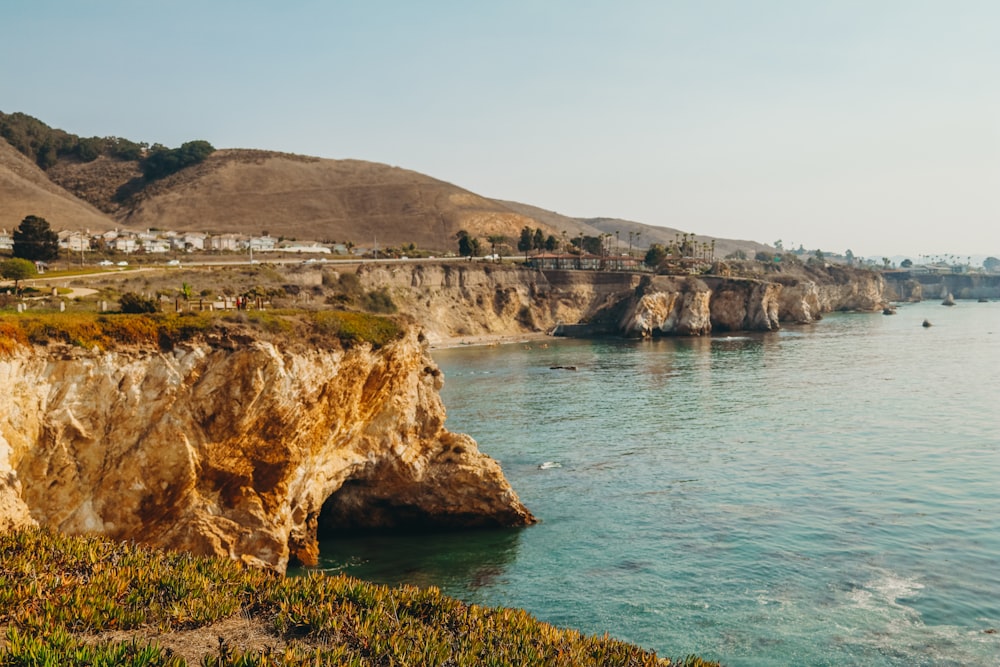 cliff near ocean during daytime