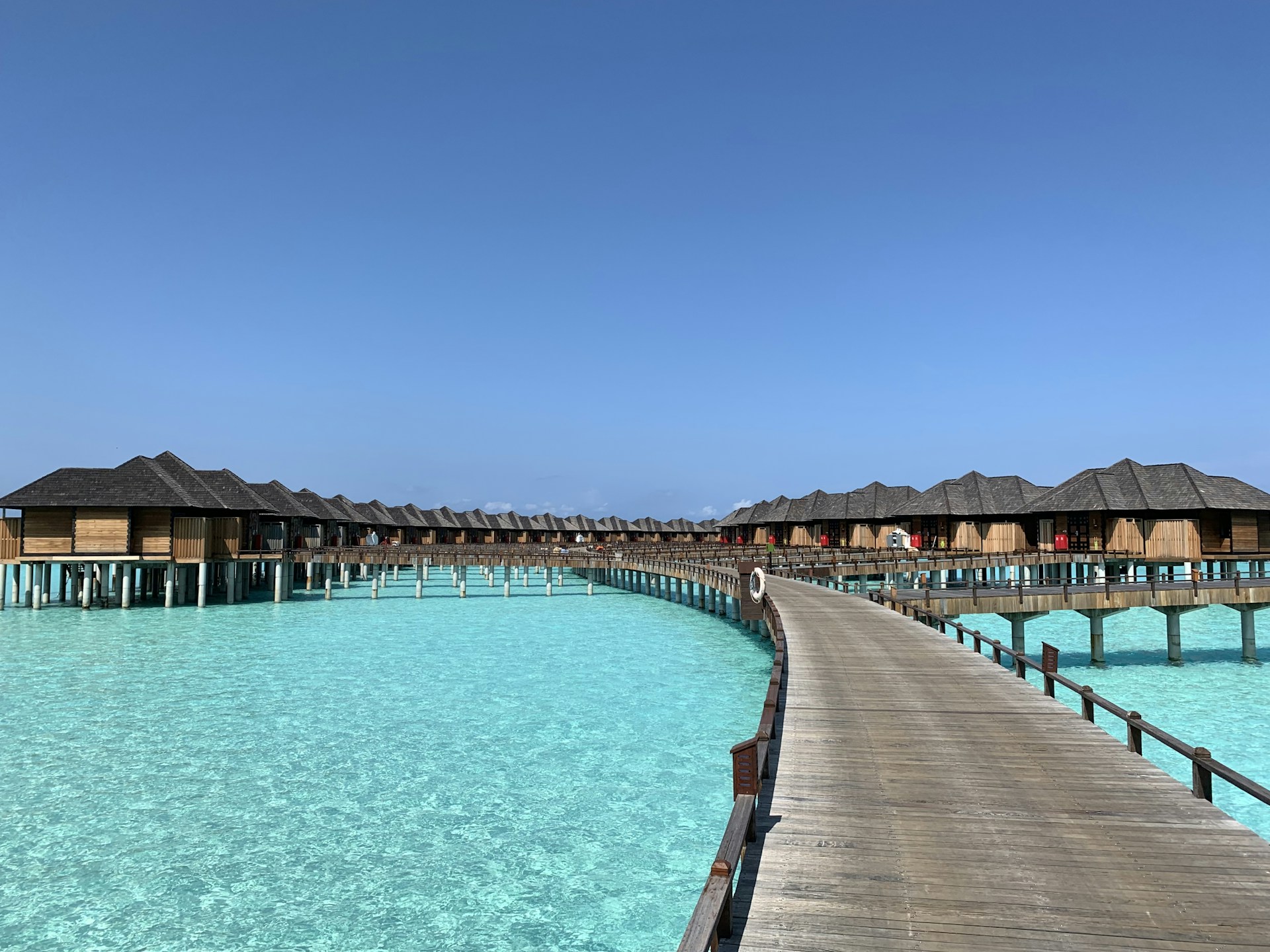 brown wooden dock under blue sky during daytime