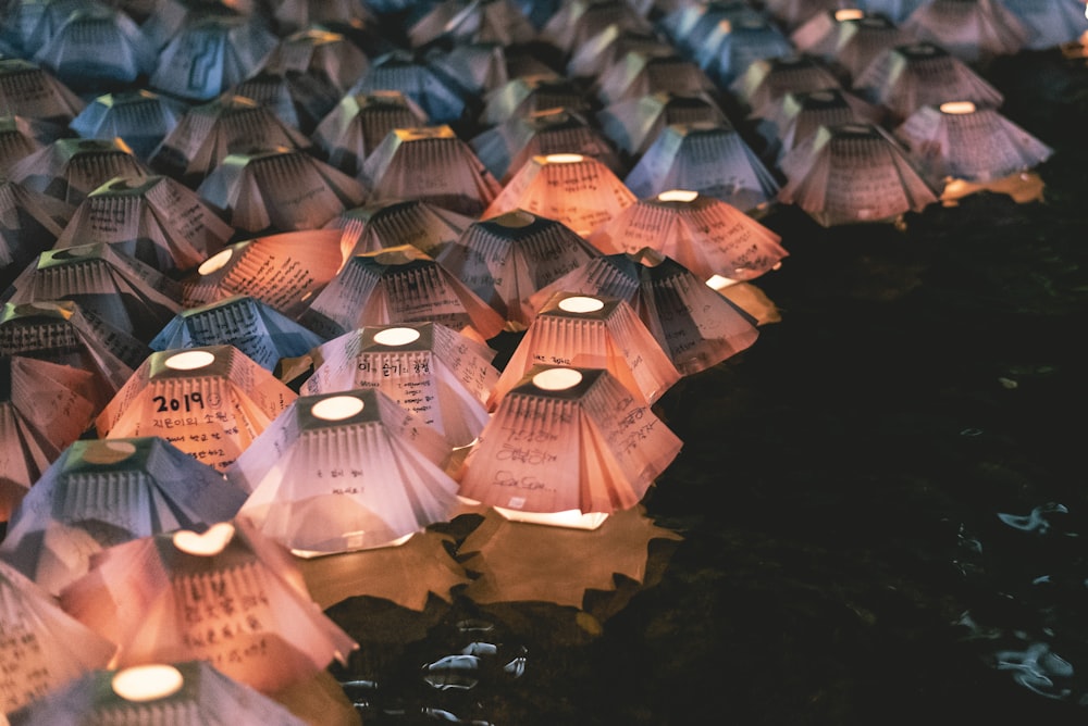 orange paper lanterns floating on water