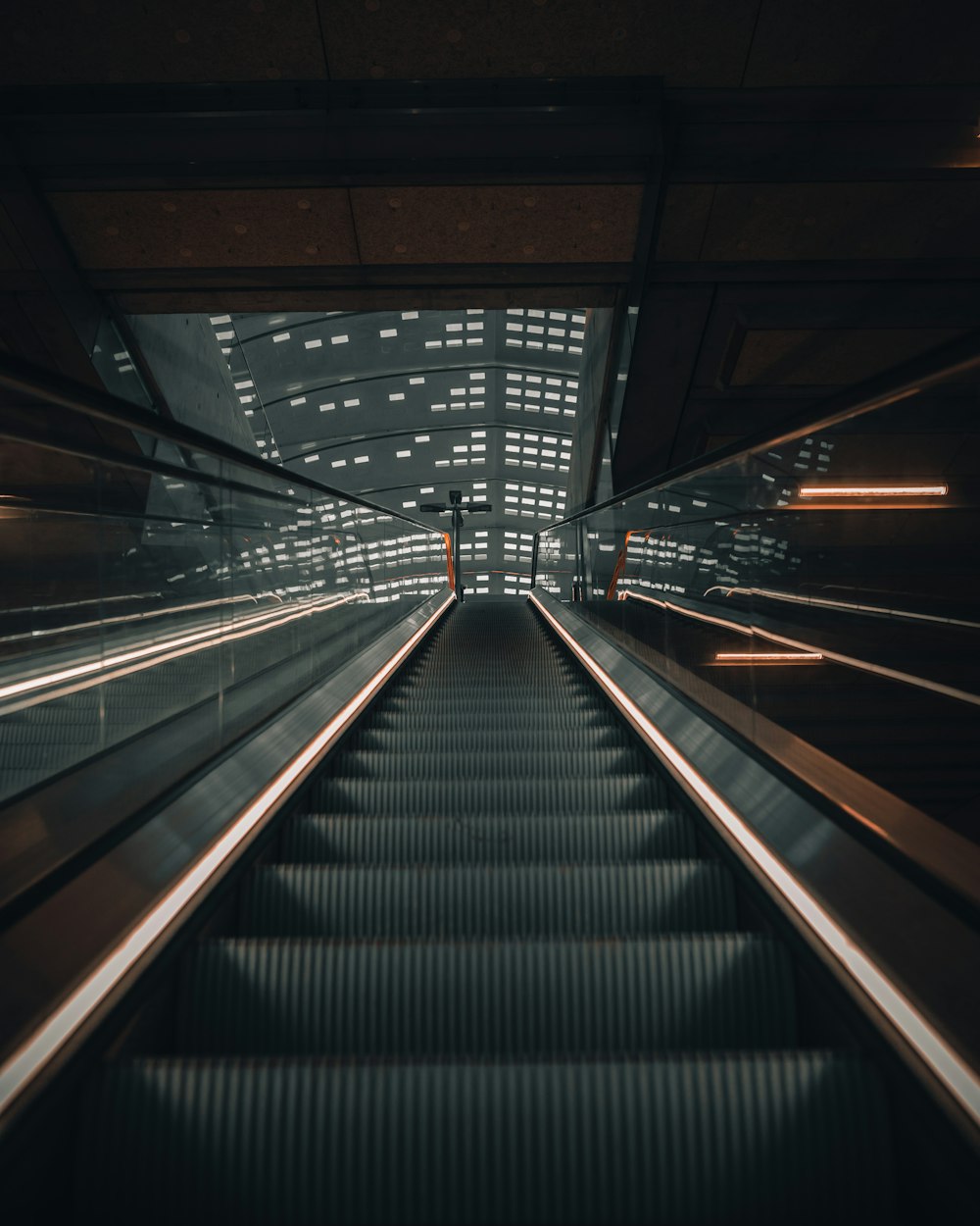 black and gray escalator inside building