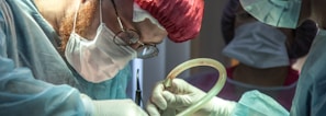 a person in a hospital operating on a patient