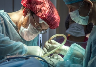 a person in a hospital operating on a patient