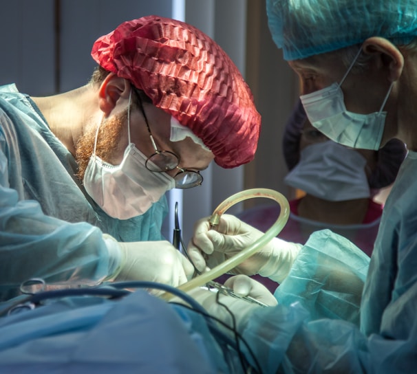 a person in a hospital operating on a patient