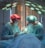 two men wearing blue lab coats