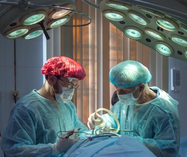 two men wearing blue lab coats