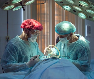 two men wearing blue lab coats