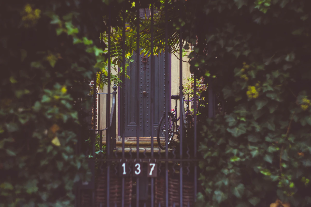 Black bicycle near door during daytime