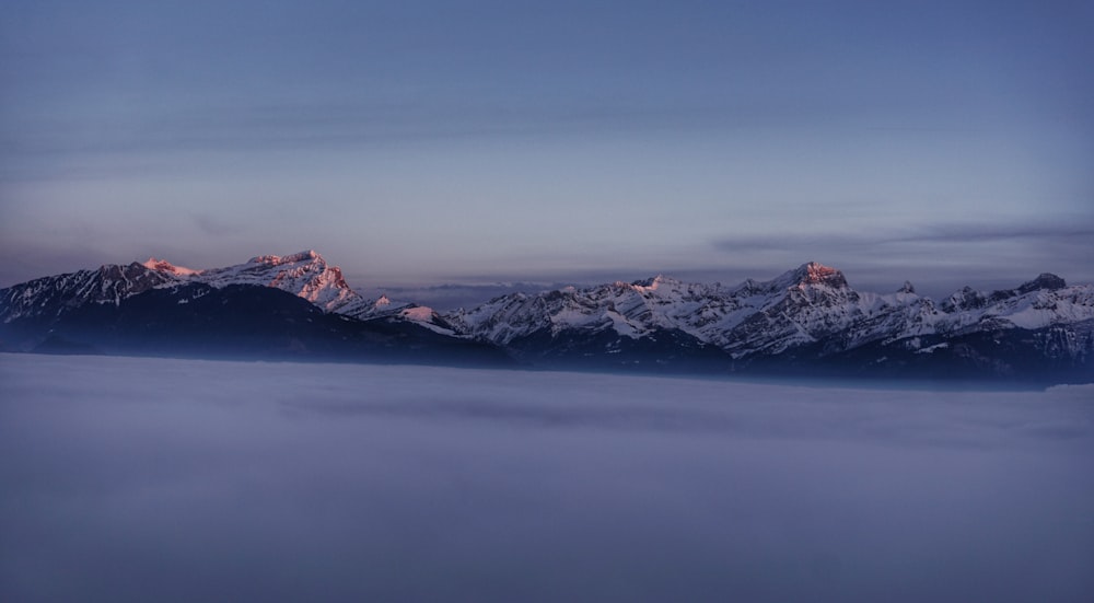 snow covered mountains during daytime