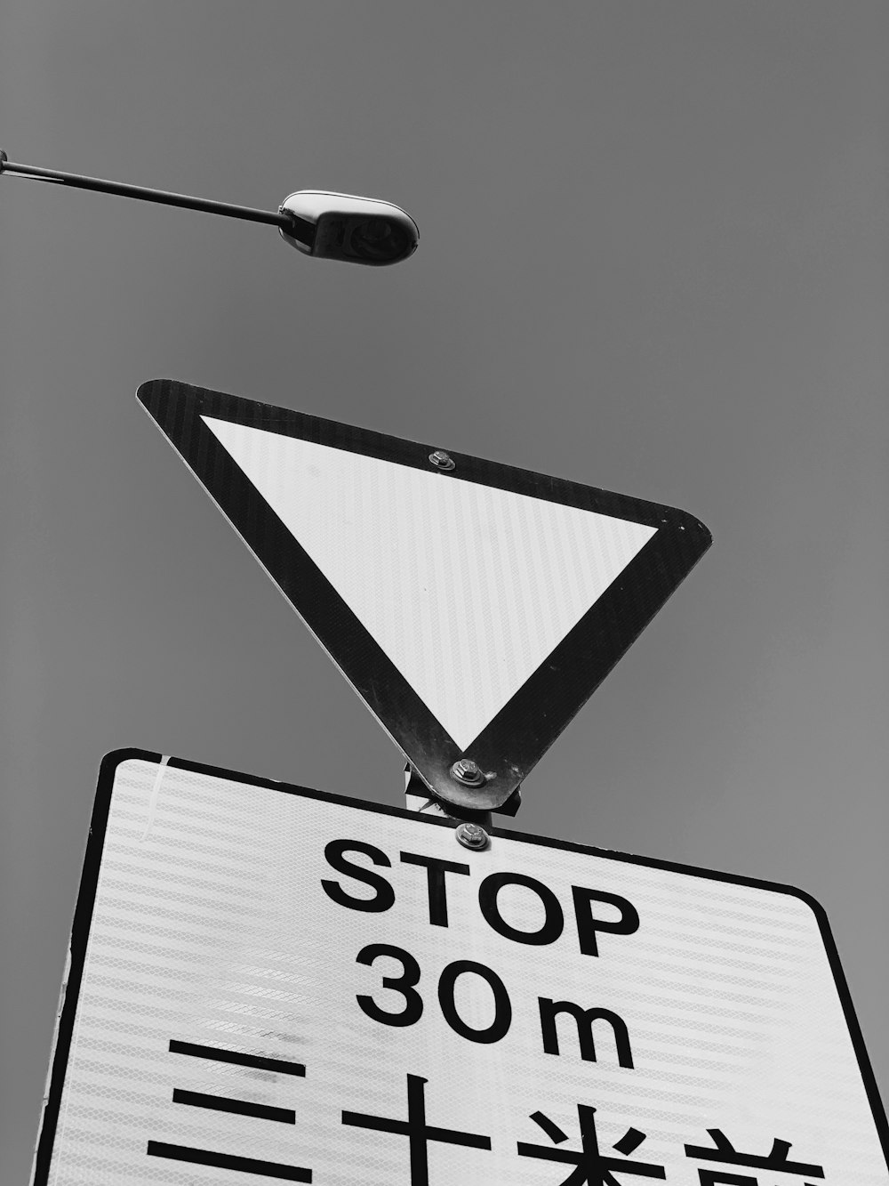 grayscale photography of road signage
