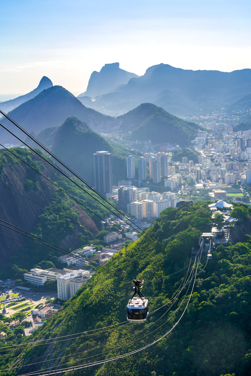 Sugarloaf Mountain cable car silhouetted at sunset over Rio de Janeiro