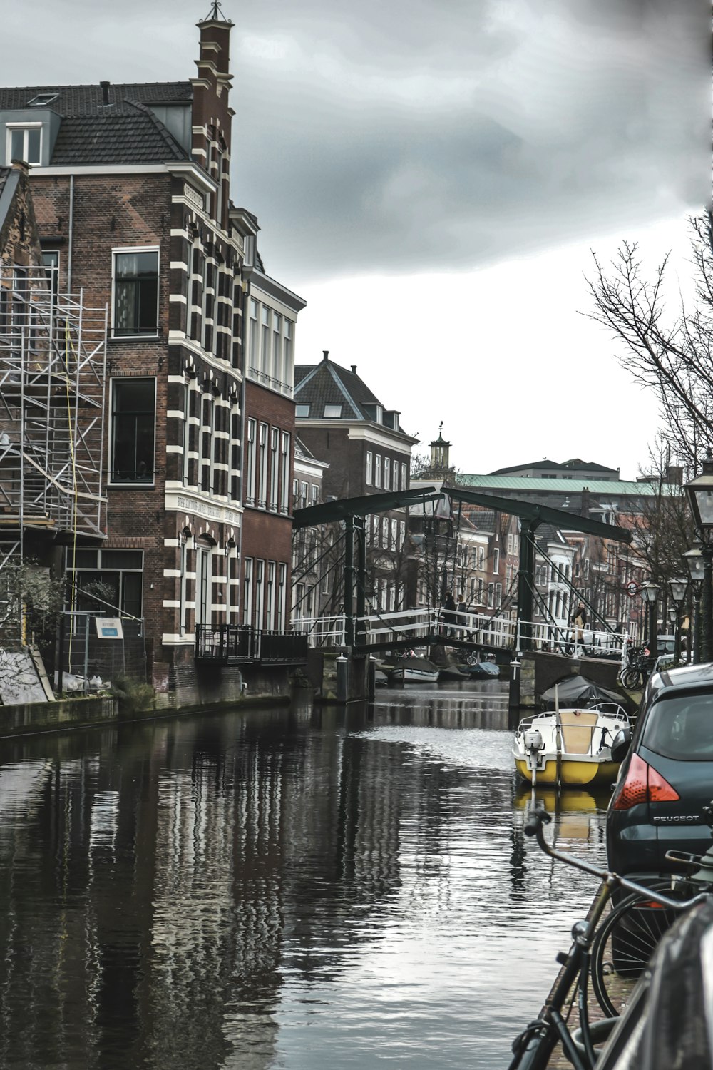 body of water beside buildings during daytime