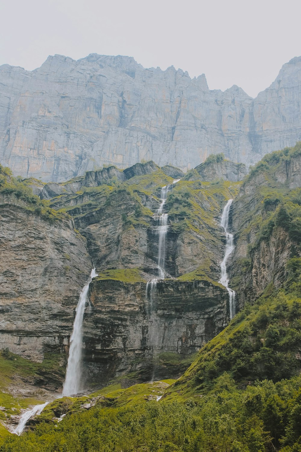 landscape photography of waterfalls between mountains