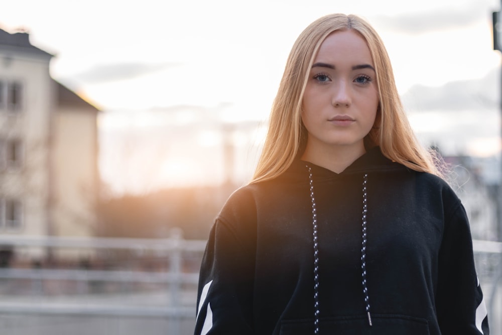 woman wearing black hoodie