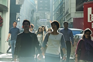 A diverse group of people walking briskly through a modern cityscape, symbolizing momentum and instant action.