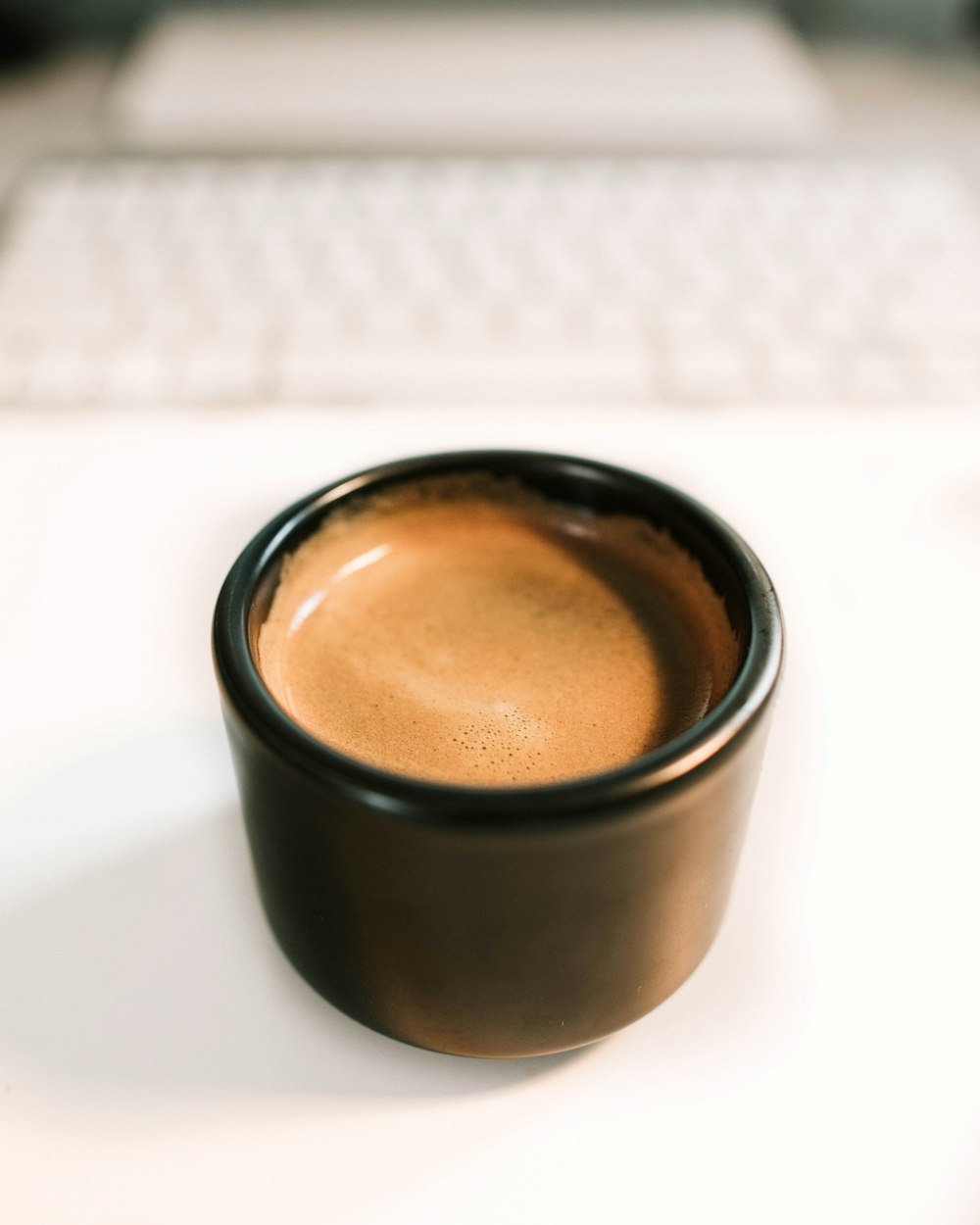 cup of coffee on white surface