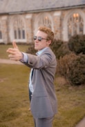 A model showcasing a perfectly fitted suit outdoors.
