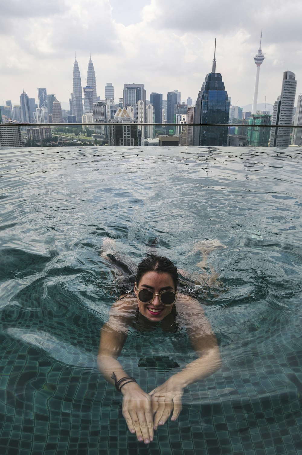 smiling woman swimming on pool