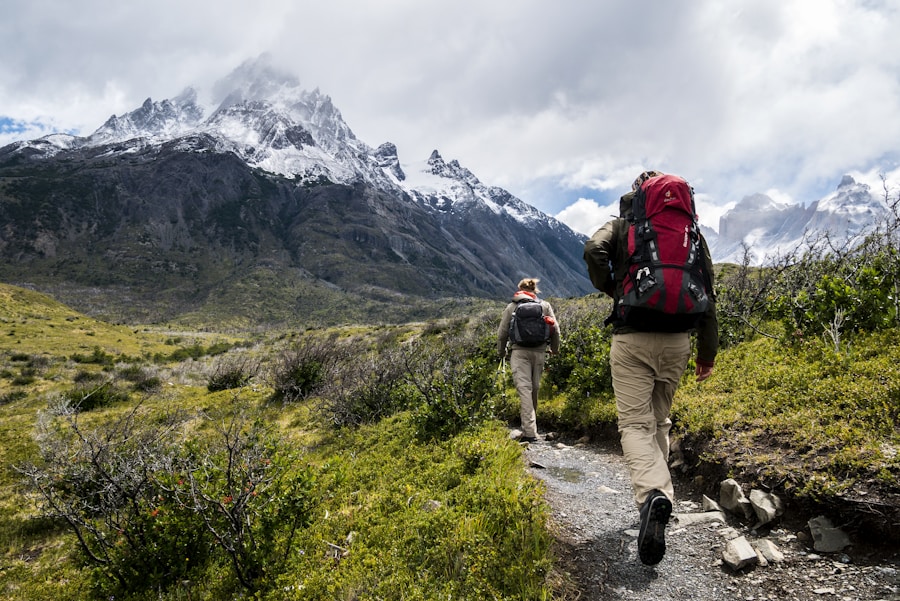 Backpacker on ridge with mountain views