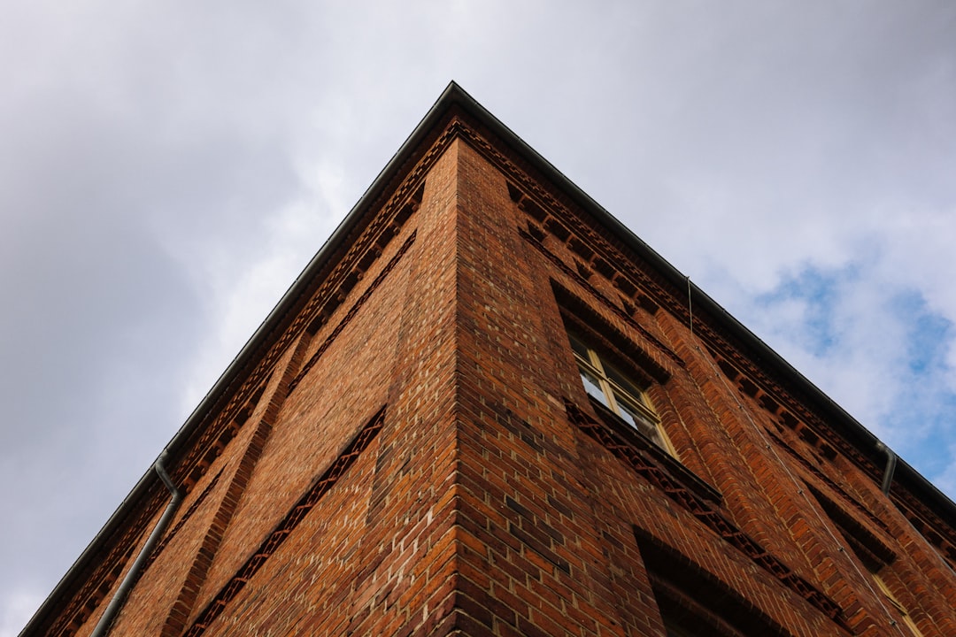 low angle photography of brown concrete building during daytime