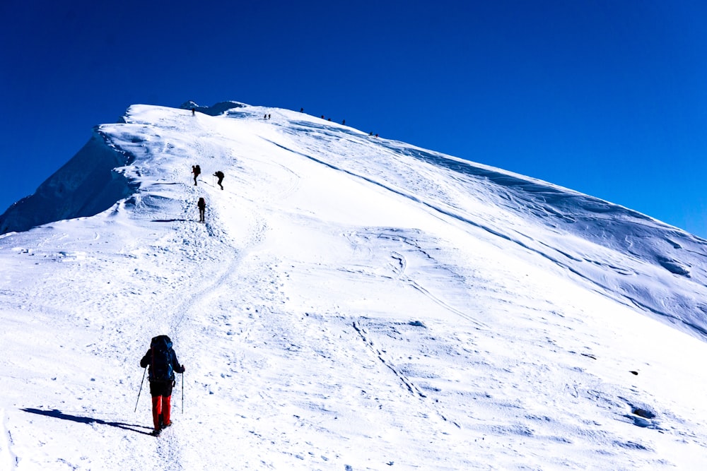 man climbing mountain