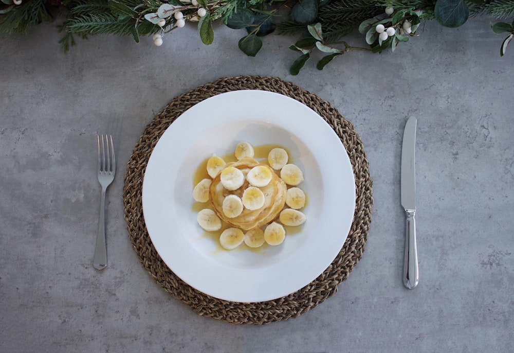 plate of dessert between table knife and fork