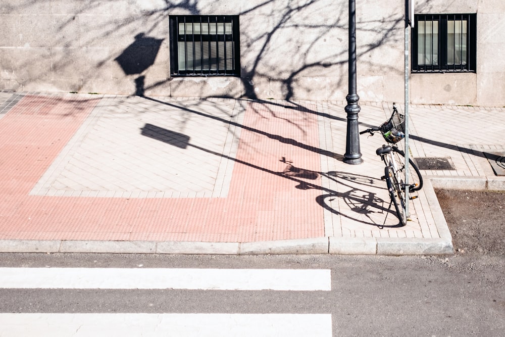 bike park near road sign and pedestrian lane