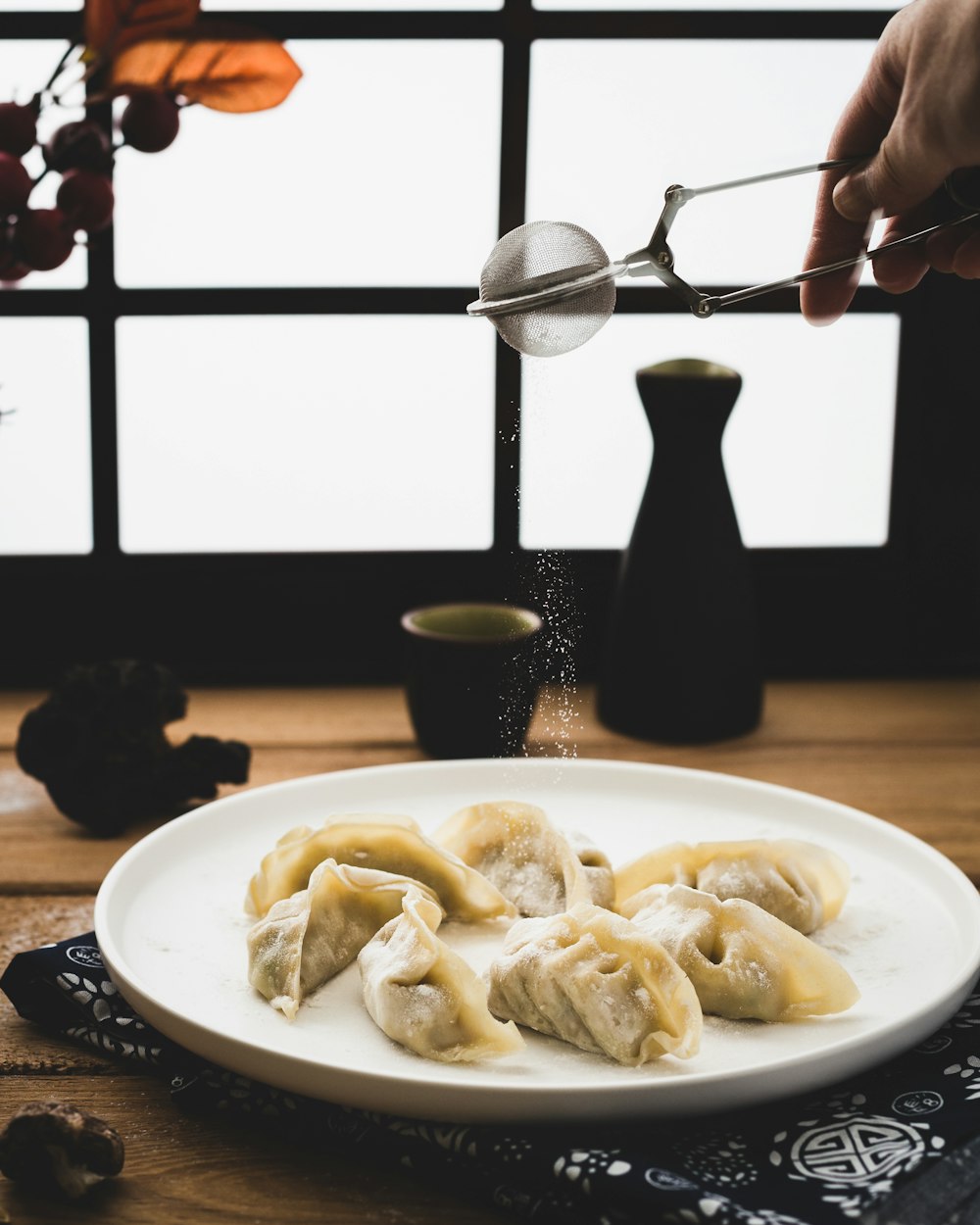 plate of dumplings on wooden surface