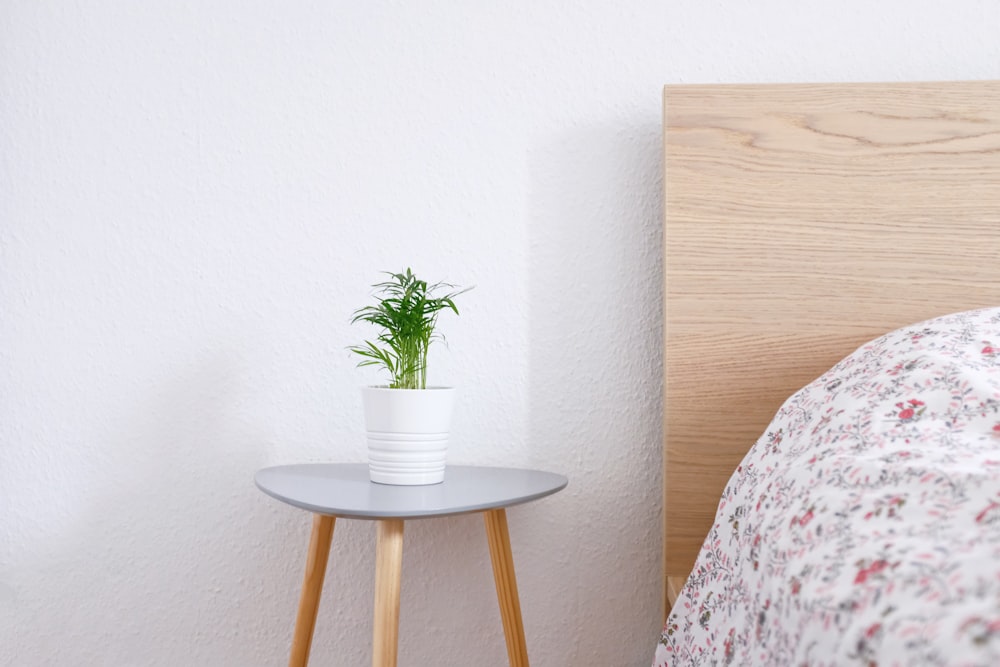 white ceramic pot on gray and brown wooden table