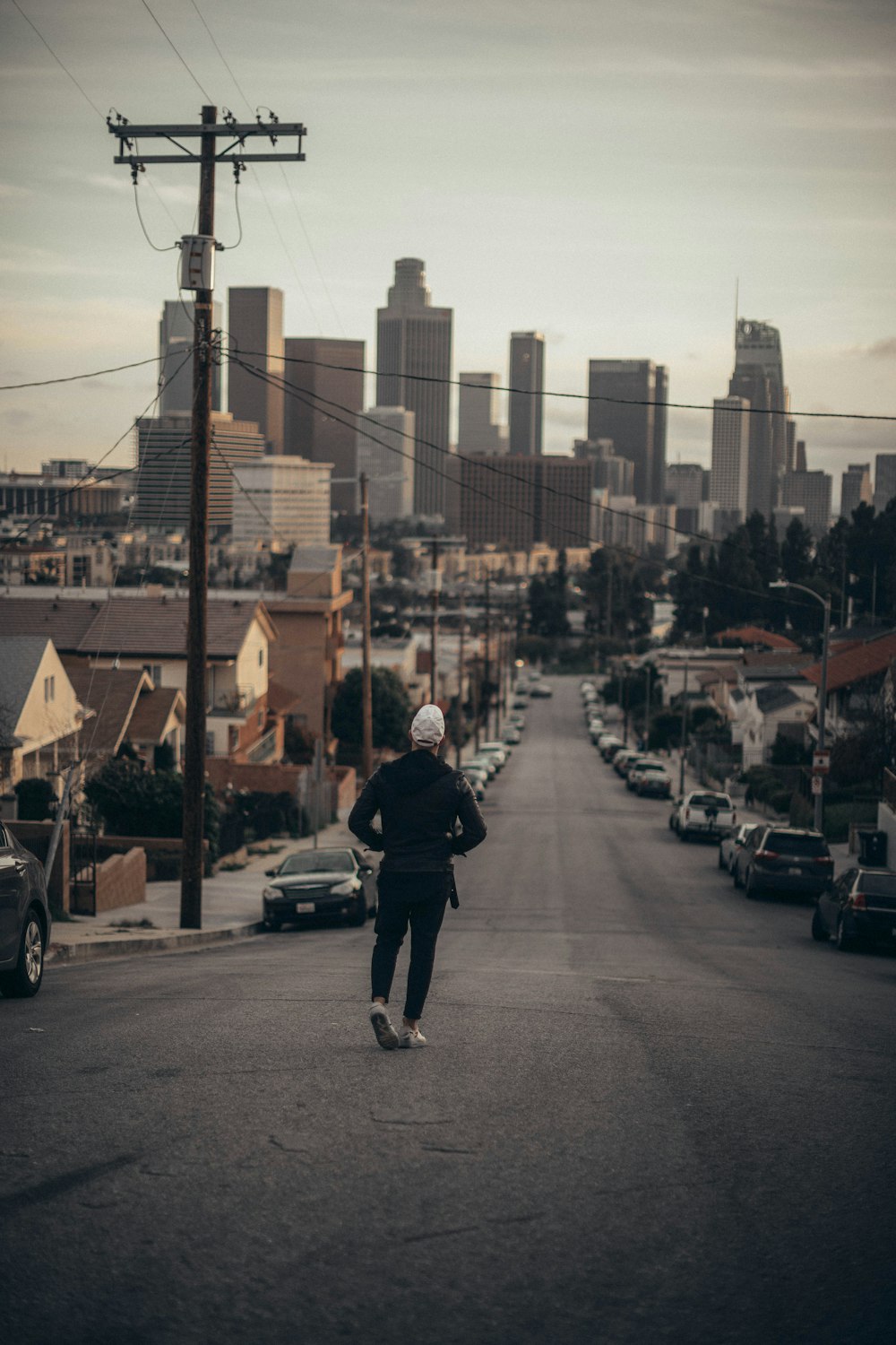 man walking on road during daytime