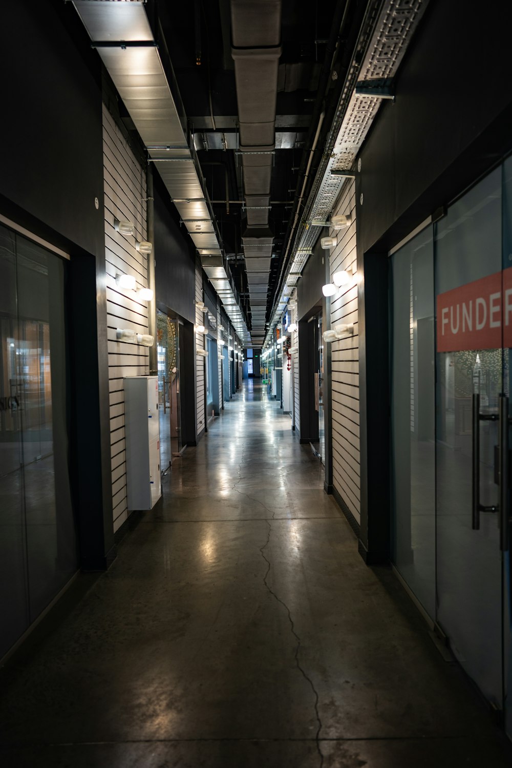 closed stores on pathway in building