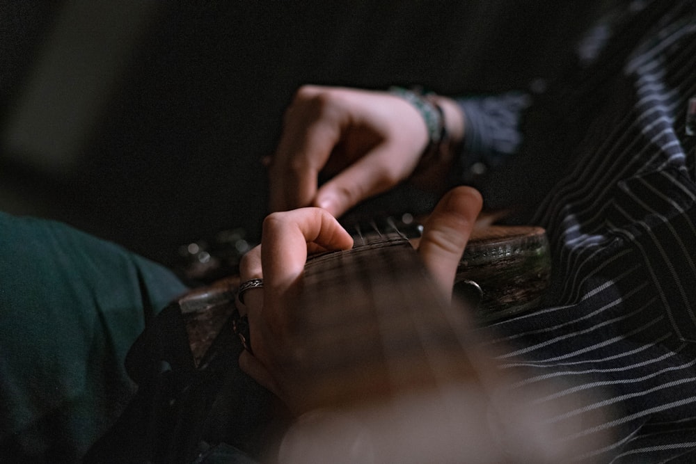 selective focus photography of guitar