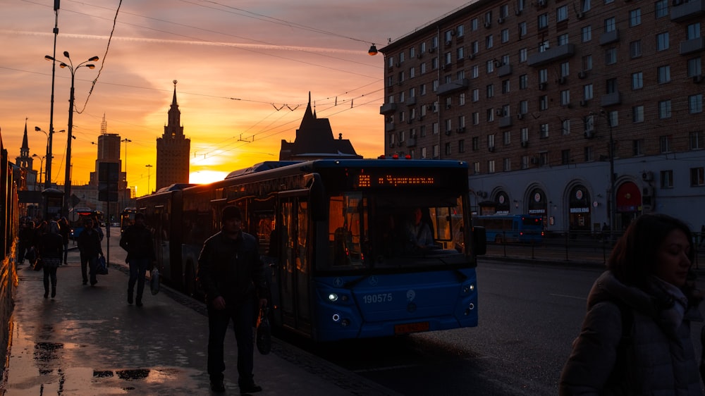 blue bus on focus photography