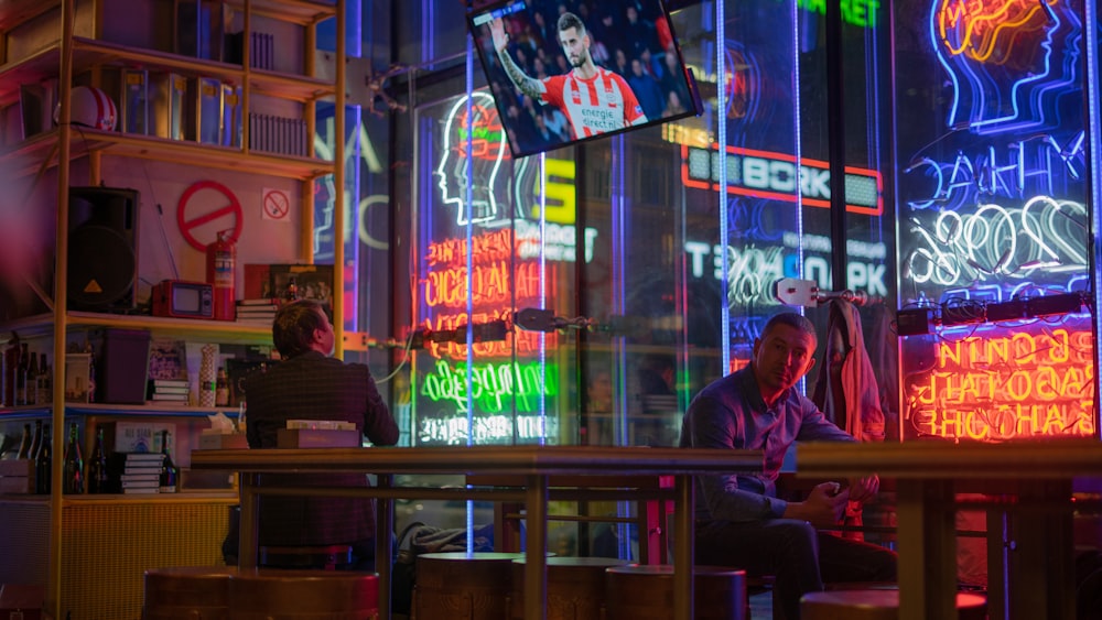 two men sitting on chairs