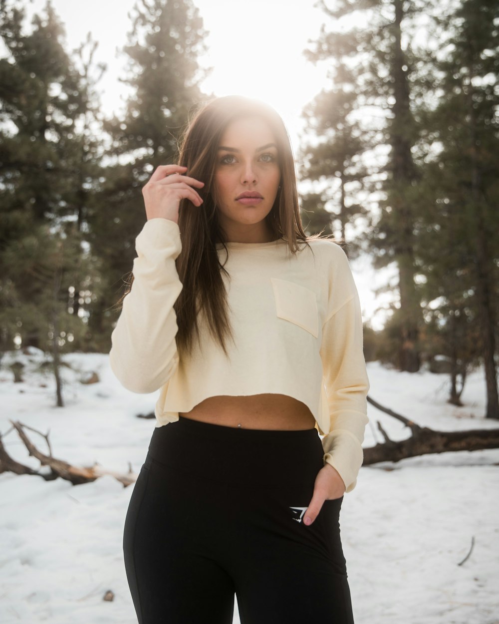 woman wearing white sweatshirt and black leggings